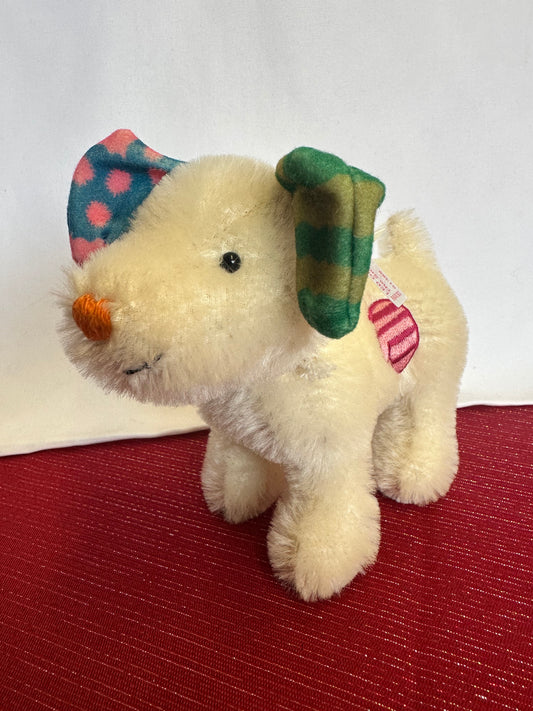 Steiff white mohair dog with bright colored ears, orange nose, and a pink design on side