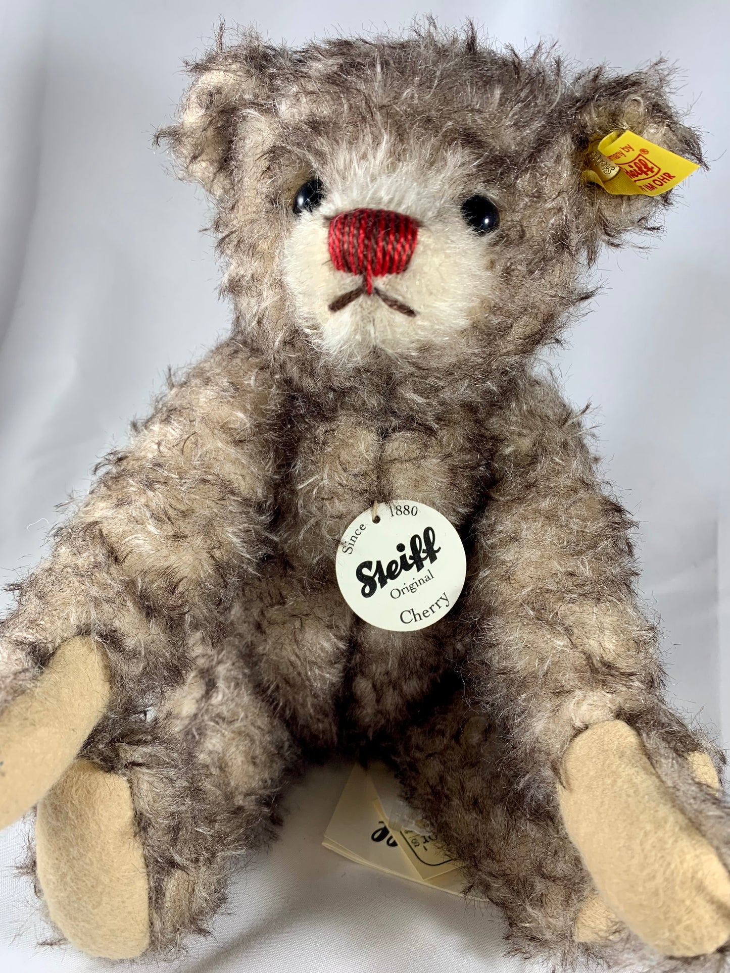 Steiff mohair Cherry teddy bear with red nose and chocolate tipped fur